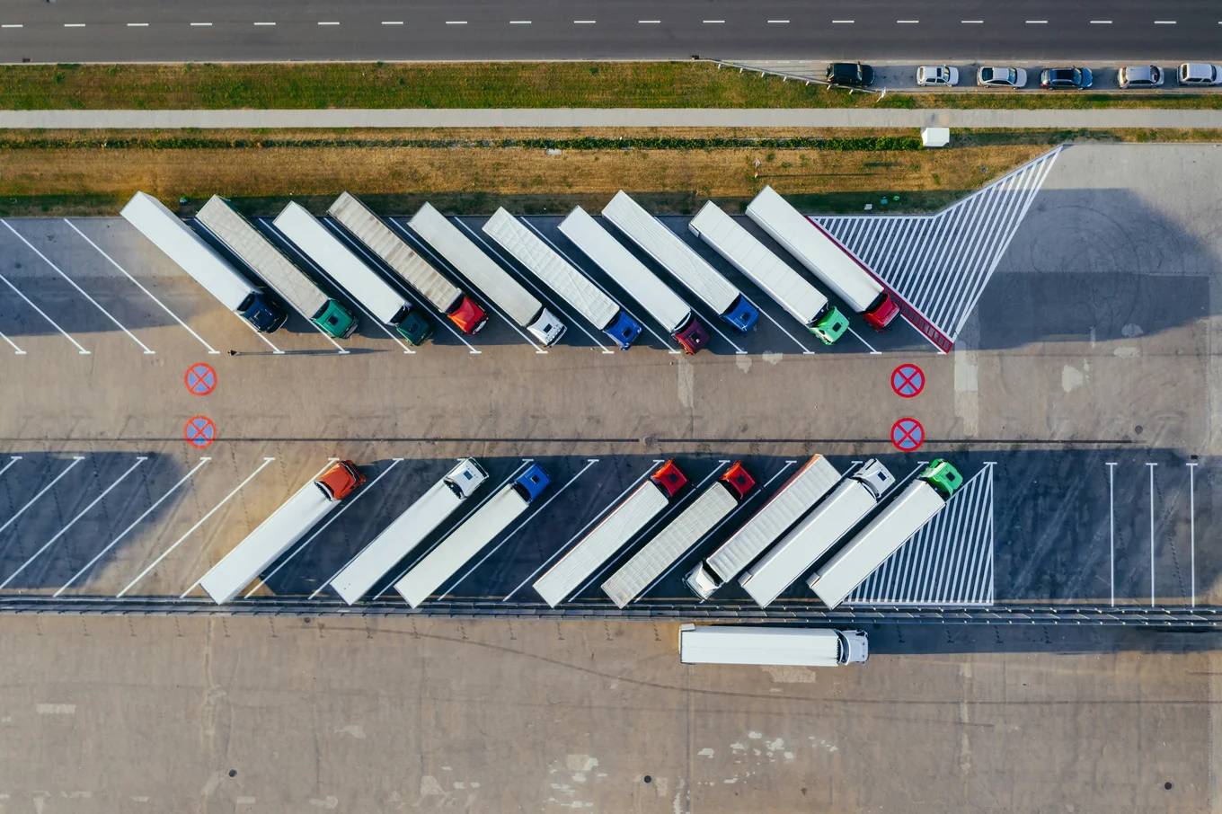 Aerial view of parked trailers in a parking lot.